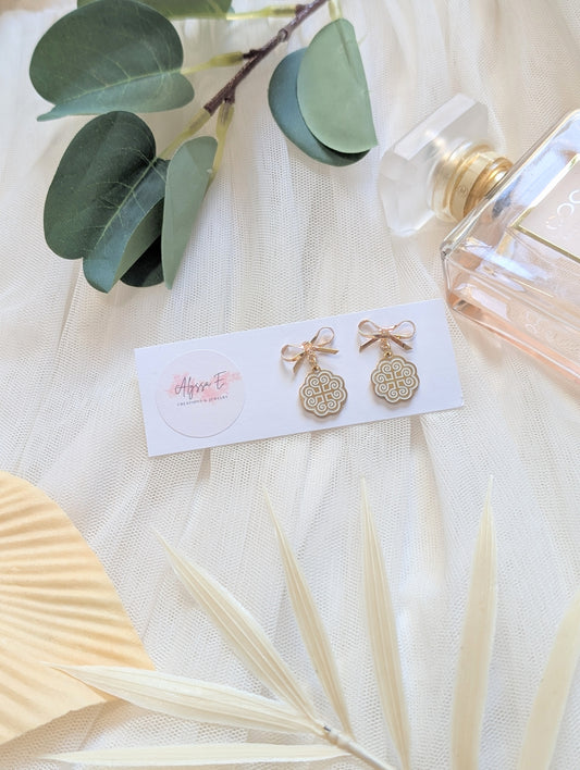 White Ram Bow Earrings